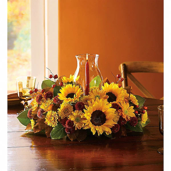 Decorative floral arrangement with sunflowers and berries