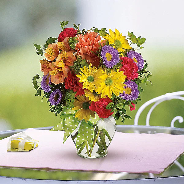 Multi-colored flowers in glass