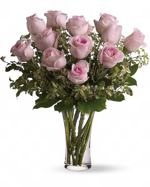 Pink roses in a clear vase