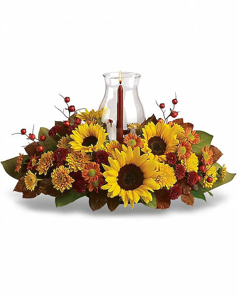 Autumn-themed floral arrangement with sunflowers and berries