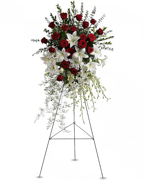 Red roses and white lilies on a stand