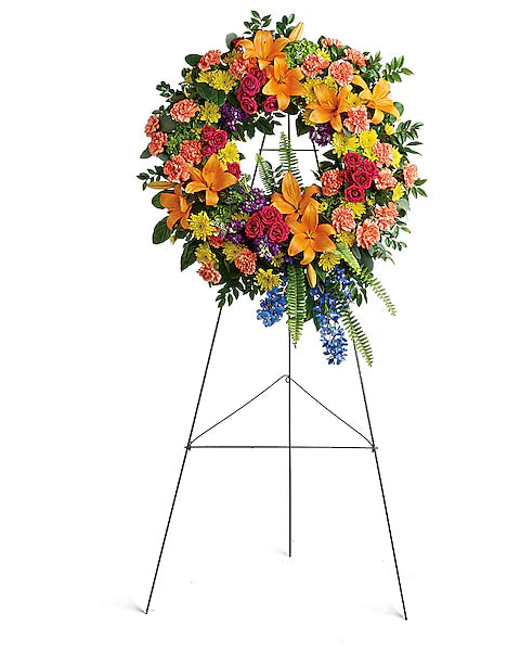 Bright and colorful wreath of flowers on display stand