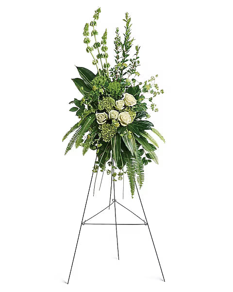 greenery and white flowers on a stand