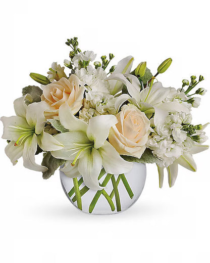Peach rose and white lily arrangement for weddings or special occasions